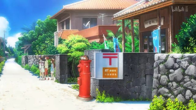 Red mailbox and wooden post office building